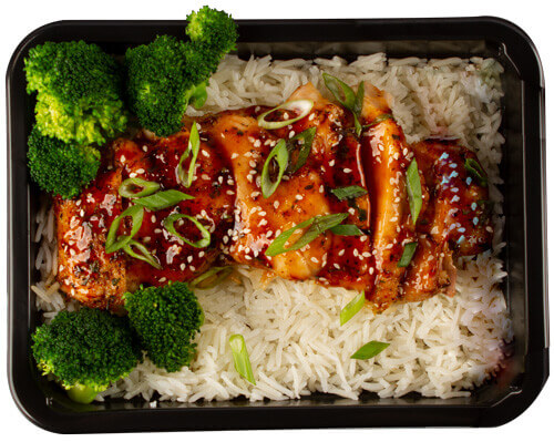 Teriyaki Chicken With Seasame Seeds Couscous Shrimp Meal Plated and Vacuum Sealed in a Meal Container