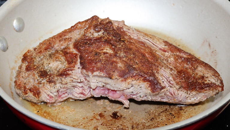 Slice tri-tip in half and sear