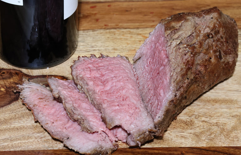 Slice tri-tip in half and sear