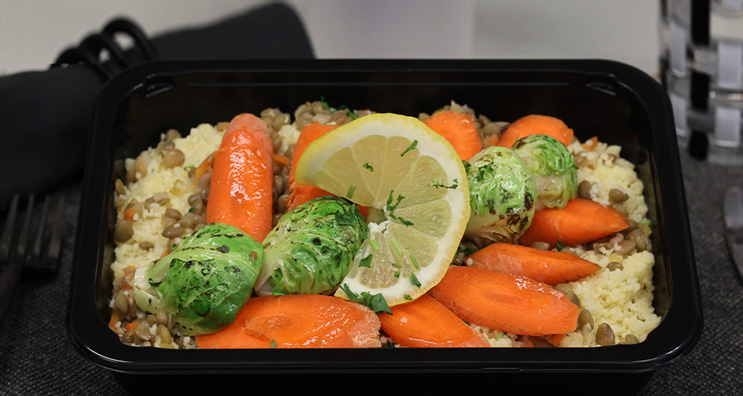 Healthy  meals plated in a microwave safe meal prep container